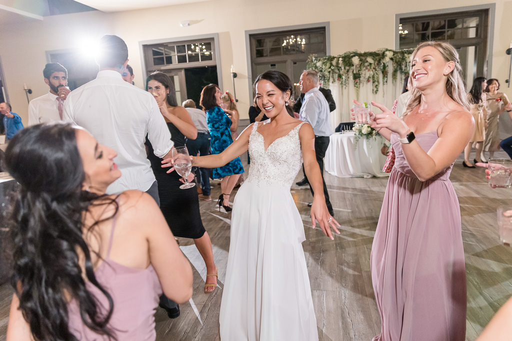 bride partying on the open dance floor with friends
