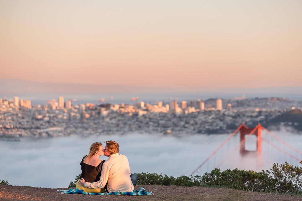 engaged couple enjoying the sunset overlooking SF downtown