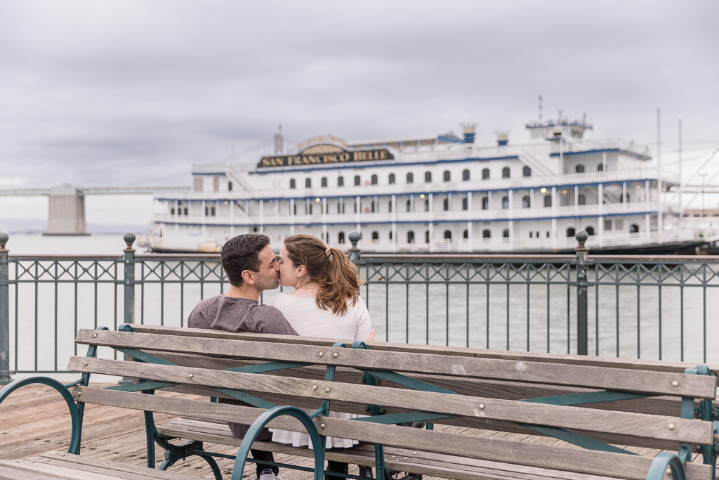 engagement photos on a bench at the San Francisco Belle ferry boat