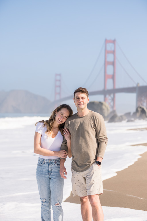 cute couple at the beach near Golden Gate Bridge