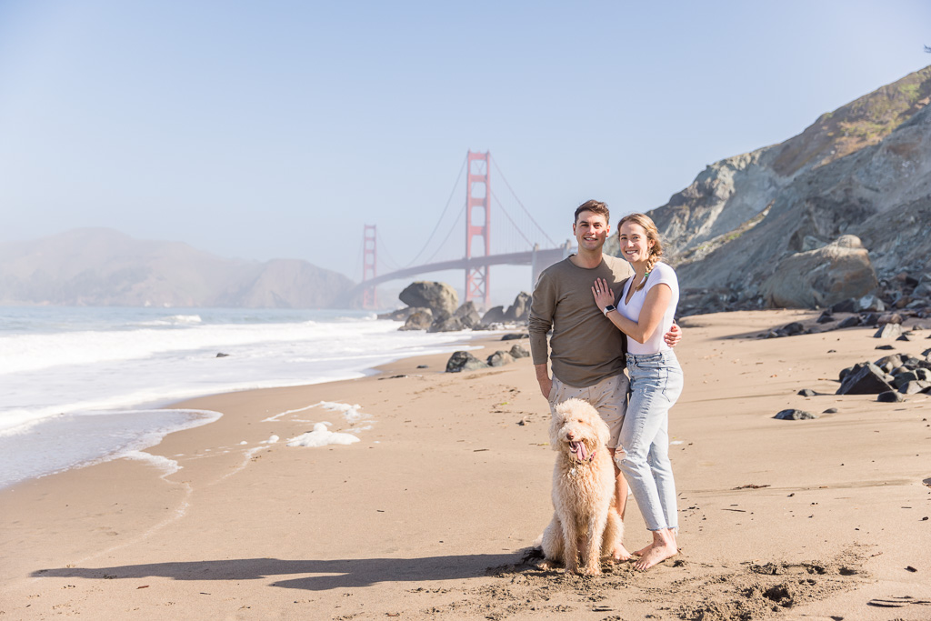 couple portrait with dog at Golden Gate Bridge beach