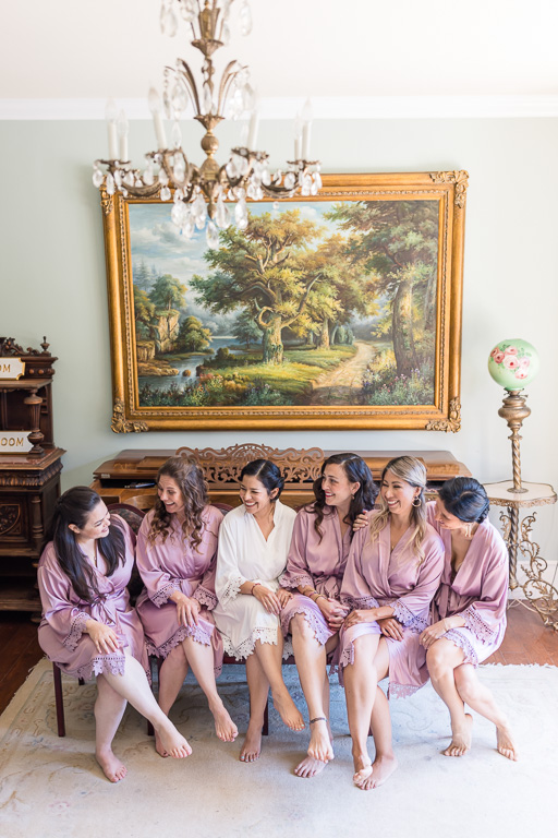 bride and bridesmaids in the piano room