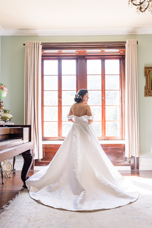 beautiful bride standing by the window