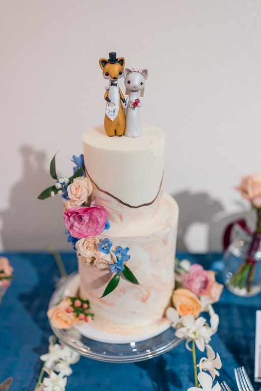 pink marble wedding cake with cute fox topper