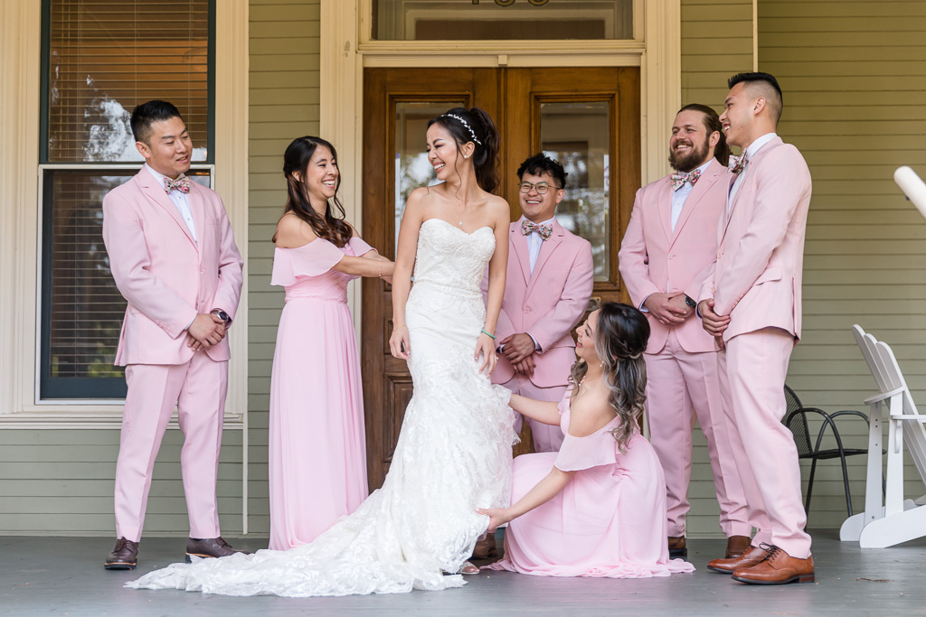 candid photo of bride and bridesmaids and bridesmen getting ready