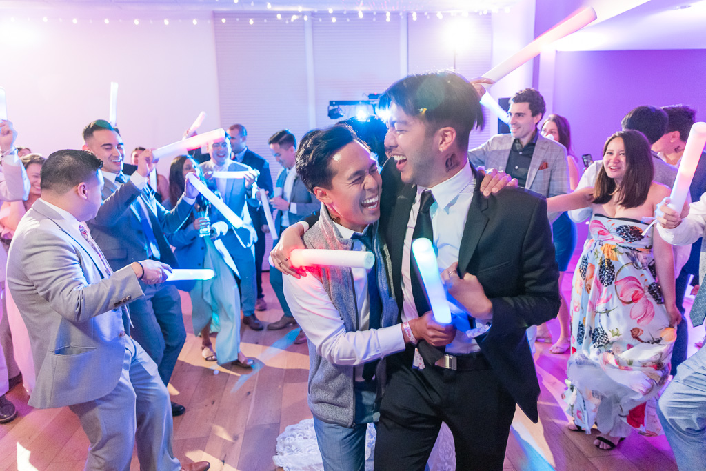 groom and his buddy dancing on the reception floor