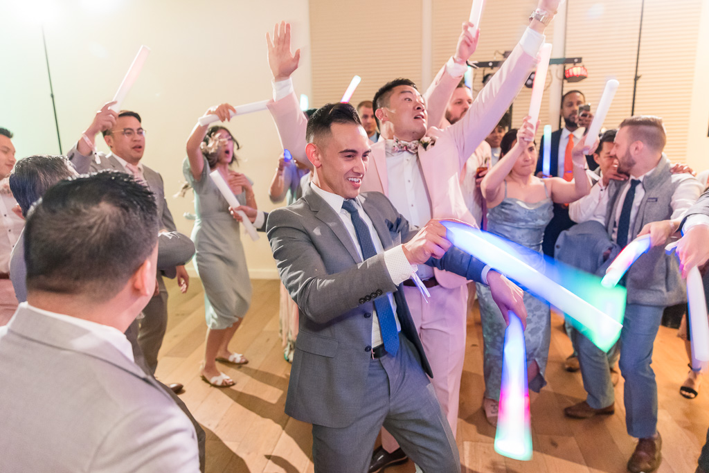 wedding guest dancing with floppy light wand