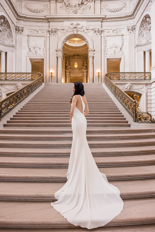 long wedding dress at San Francisco City Hall grand staircase