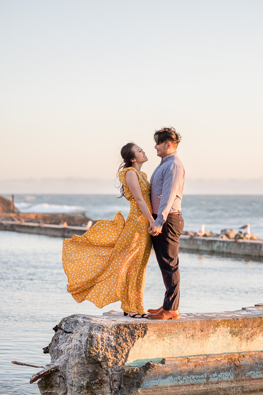 sunset engagement photos in long yellow dress