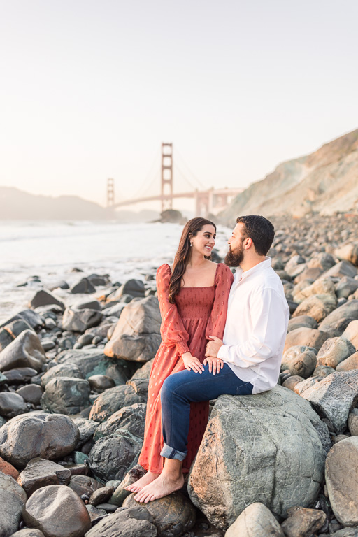 engagement photos on the rocks at the beach