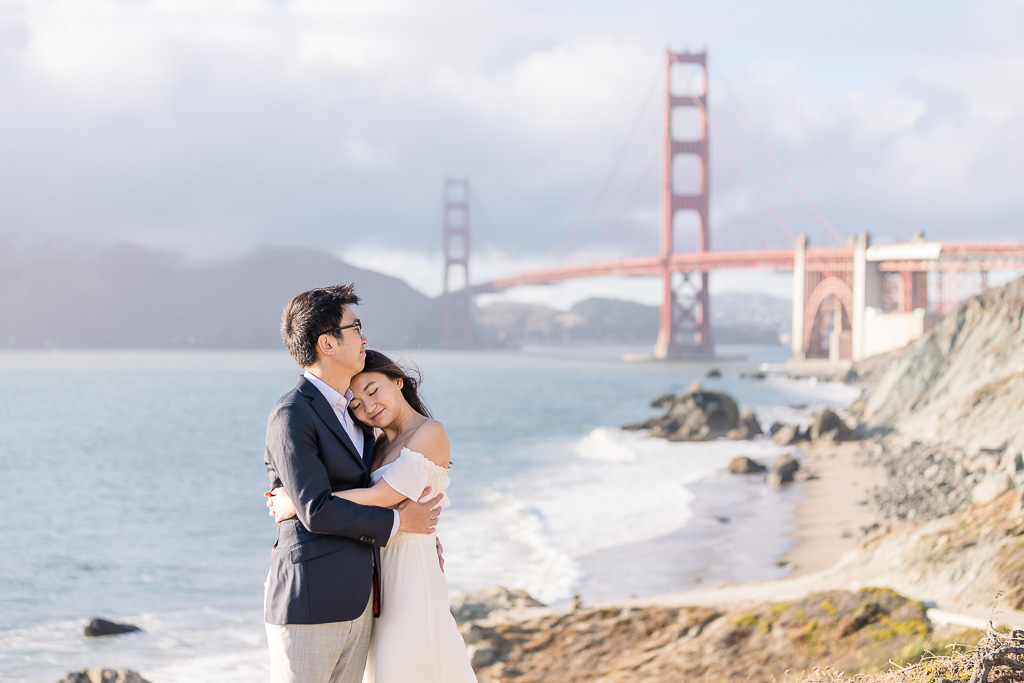quiet, romantic engagement photos in front of the Golden Gate Bridge and ocean view