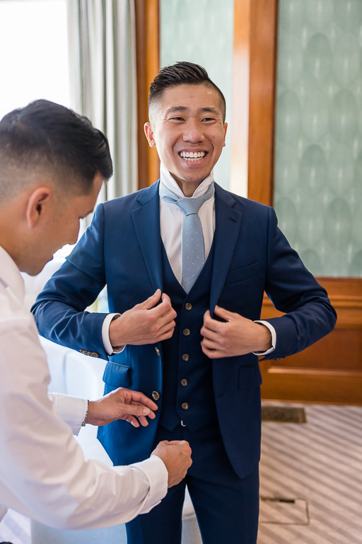 groom getting ready for wedding at Hayes Mansion