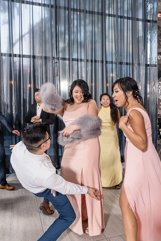 guests having fun dancing at wedding reception