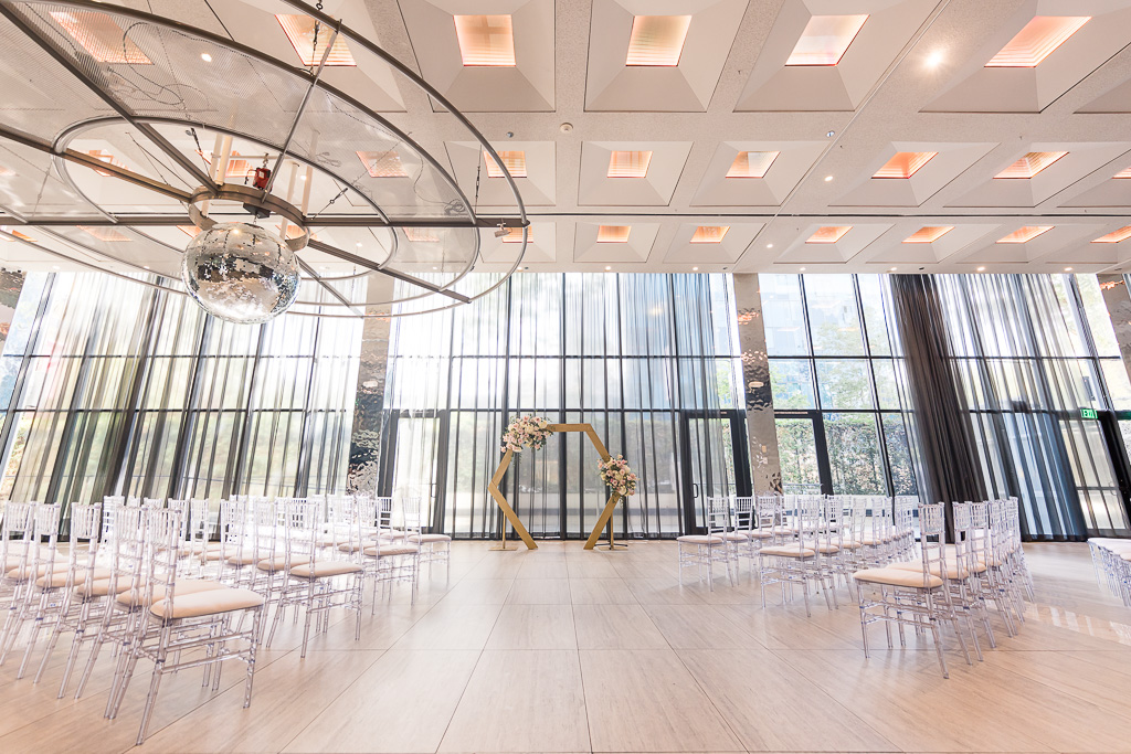 The GlassHouse SJ modern, clean indoor wedding ceremony decor and chairs