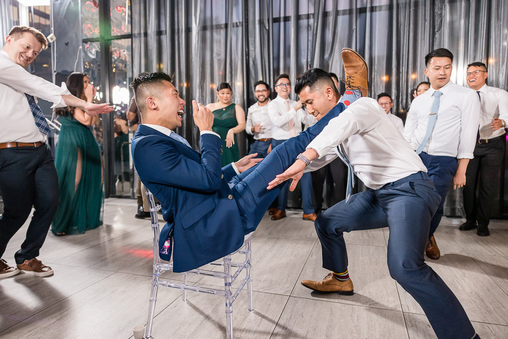 crazy dancing with groom in a chair