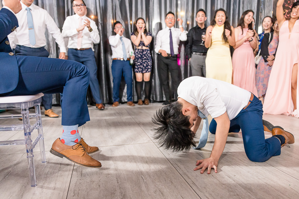 groom getting some interesting dances during reception