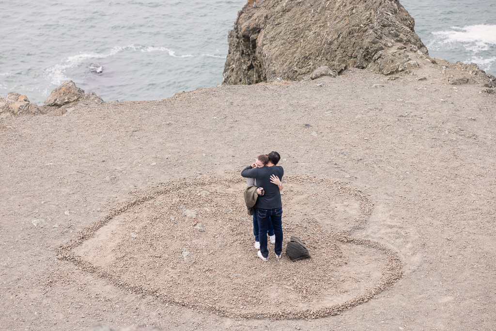 couple inside heart shape made of rocks