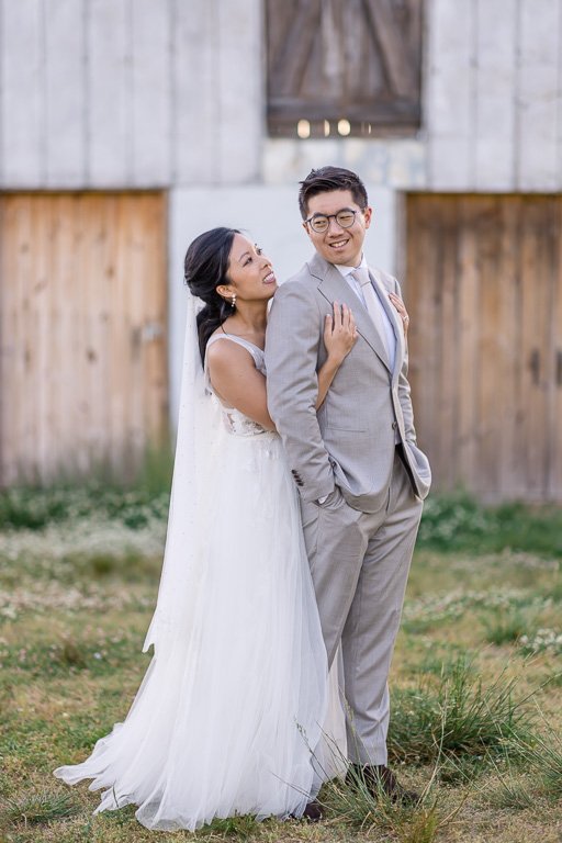 wedding portrait in front of a rustic barn