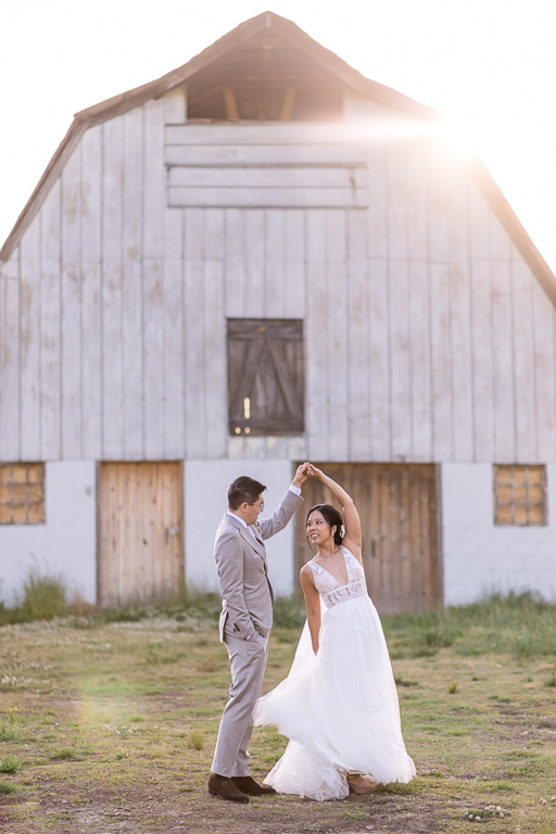 romantic sunset wedding photo at a rustic barn