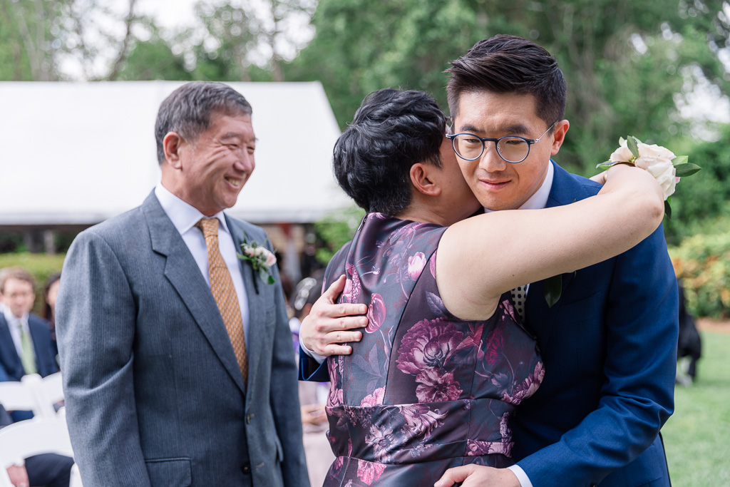 groom hugging mom and dad