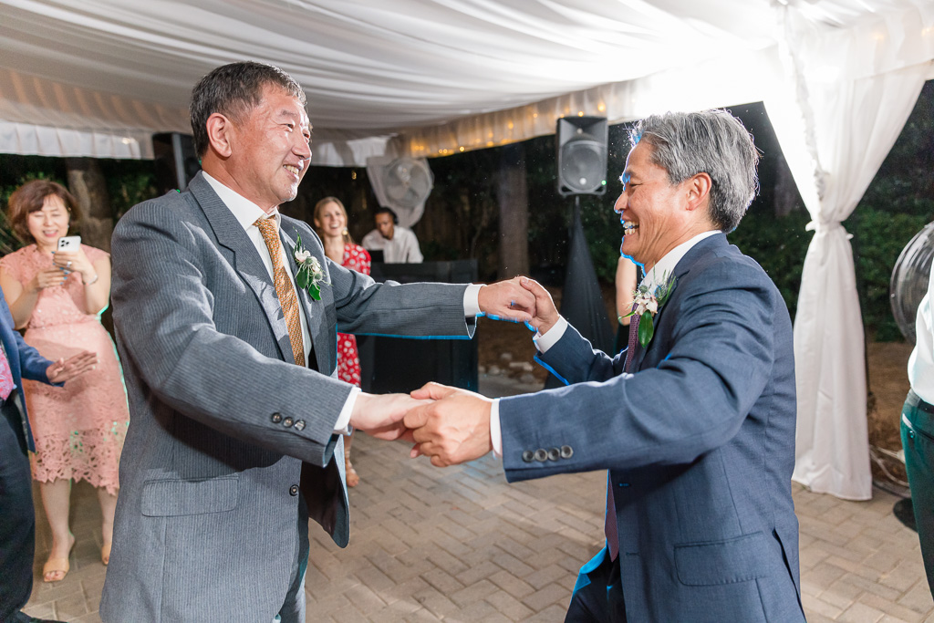 two dads dancing together celebrating wedding