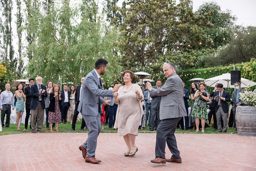 groom dancing with his parents