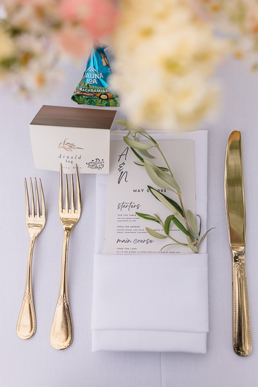 place setting with elegant golden silverware and leaf decor