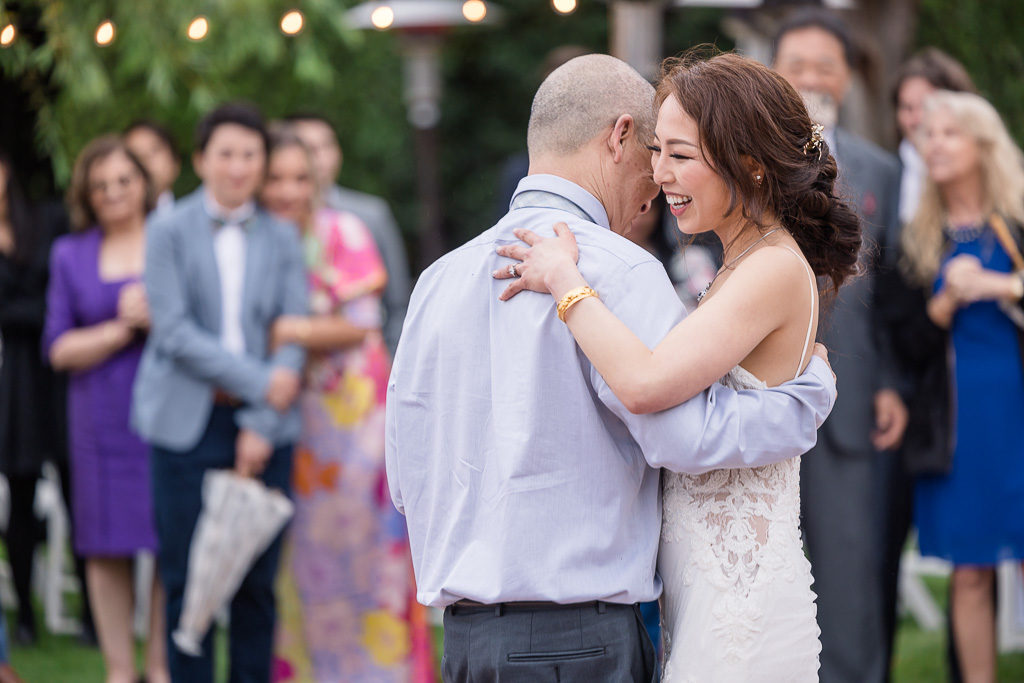 bride happily dancing with her dad