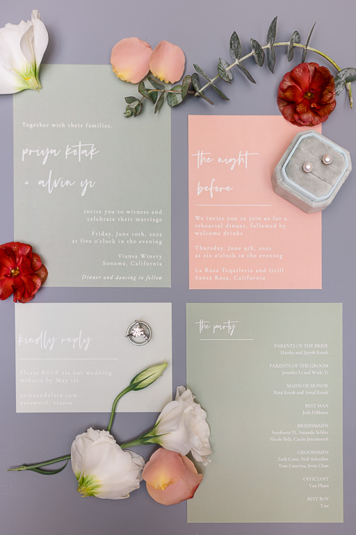 sage and coral wedding invitation suite flatlay