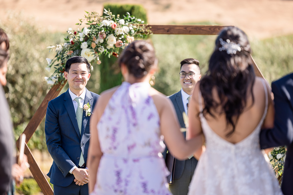 groom's reaction seeing bride as she walks down the aisle