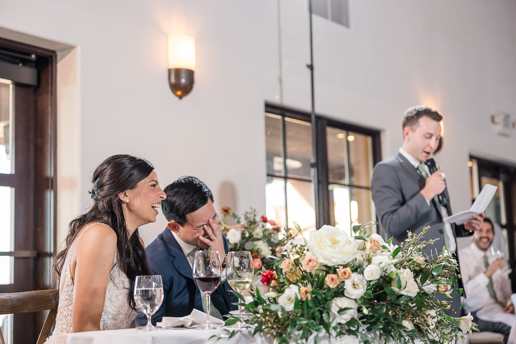 bride and groom facepalming at best man speech