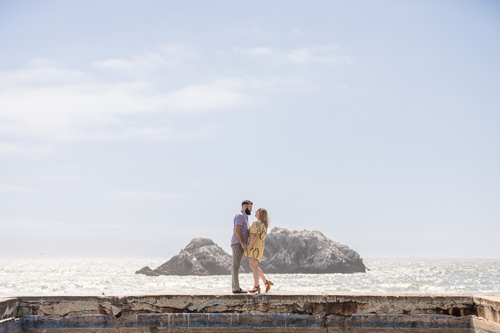 engagement photos at Sutro Baths in front of the rocks