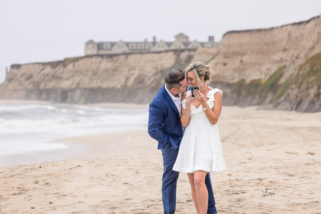 candid moment of couple at Pelican Point Beach