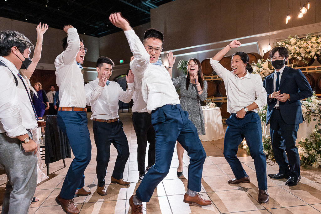 groom and his friends dancing on the dance floor