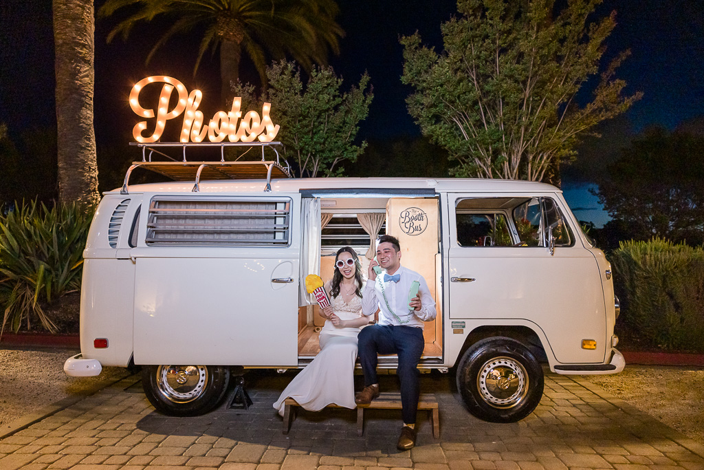 silly quirky photo of the bride and groom in front of a retro VW Bus
