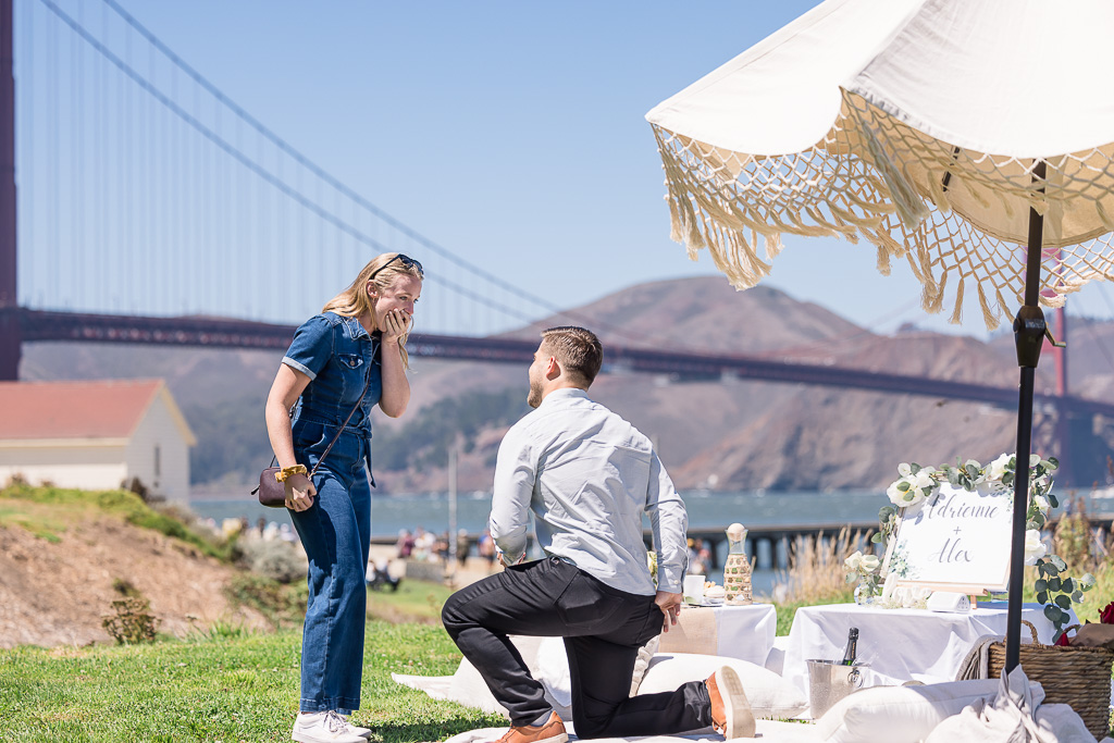 picnic surprise proposal in front of the Golden Gate Bridge