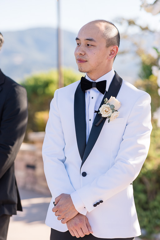groom waiting for bride to walk down the aisle