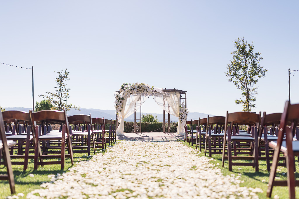 Boulder Ridge by Wedgewood Weddings ceremony site with flower petals