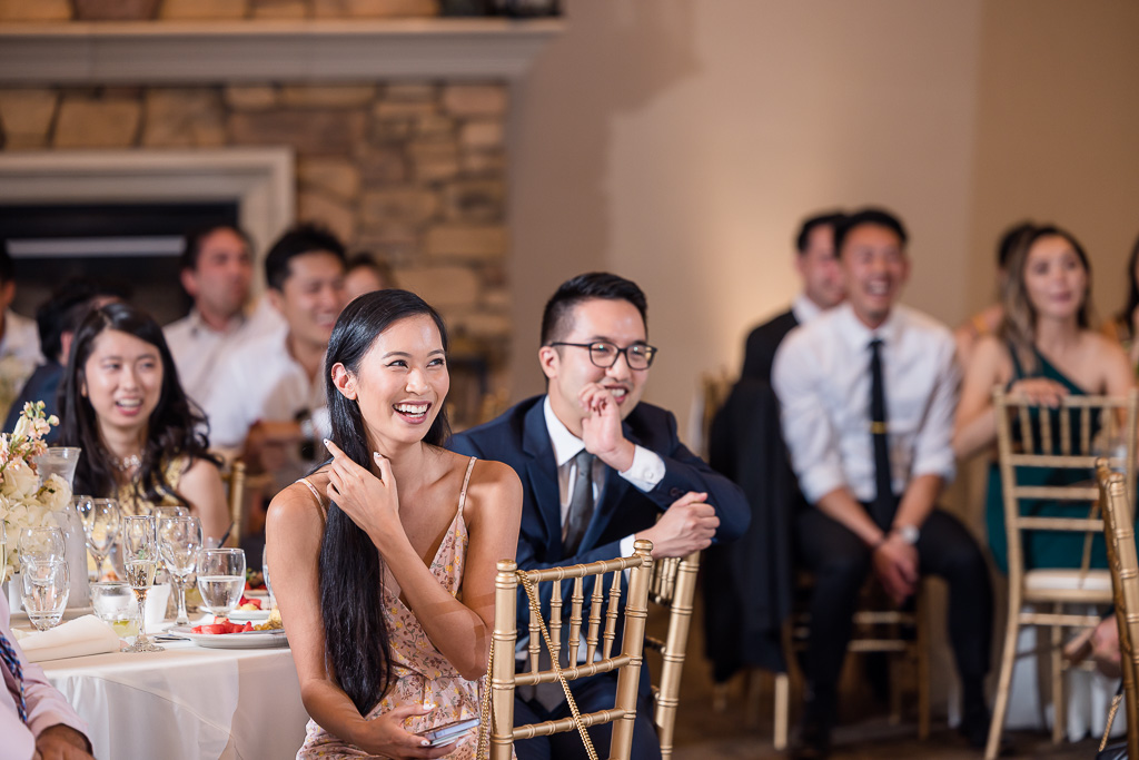wedding guests laughing at speeches