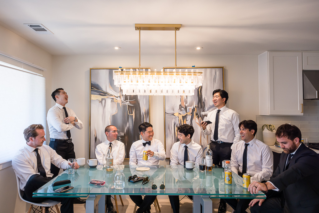 groom and groomsmen playing a drinking game