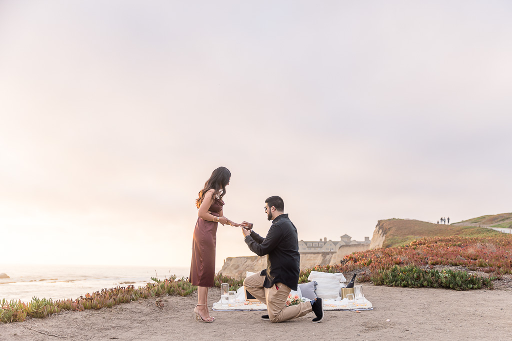 oceanside romantic sunset picnic surprise engagement in Half Moon Bay