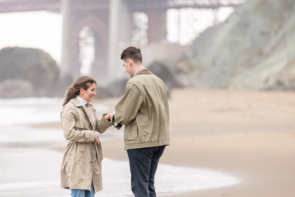 engaged on the beach