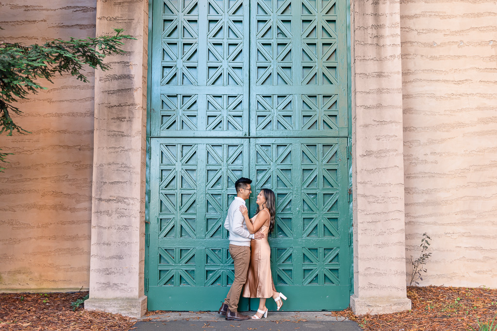 couple’s portraits in front of a green door