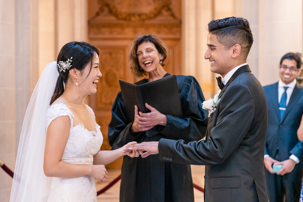 officiant and couple sharing a happy moment during civil ceremony