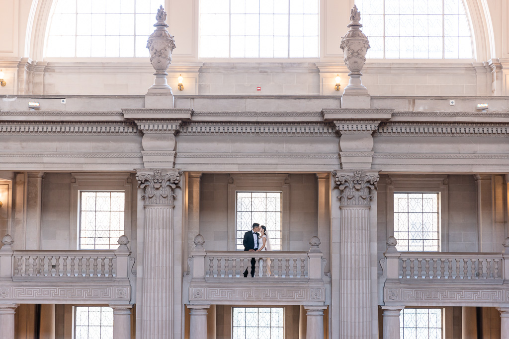 faraway shot of bride and groom at SF City Hall