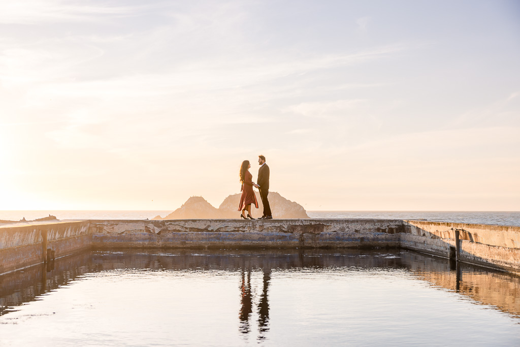 couple standing at the Sutro Baths reflecting pool