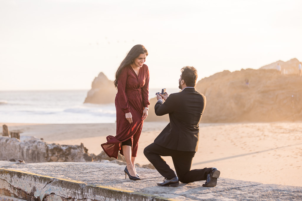 sunset surprise proposal at the ocean
