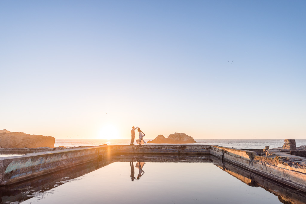 Sutro Baths semi-silhouette photo with water reflection at sunset