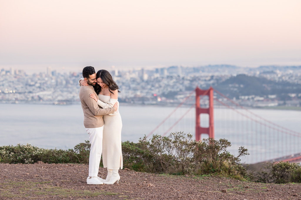 engagement photos above SF city skyline and Golden Gate Bridge