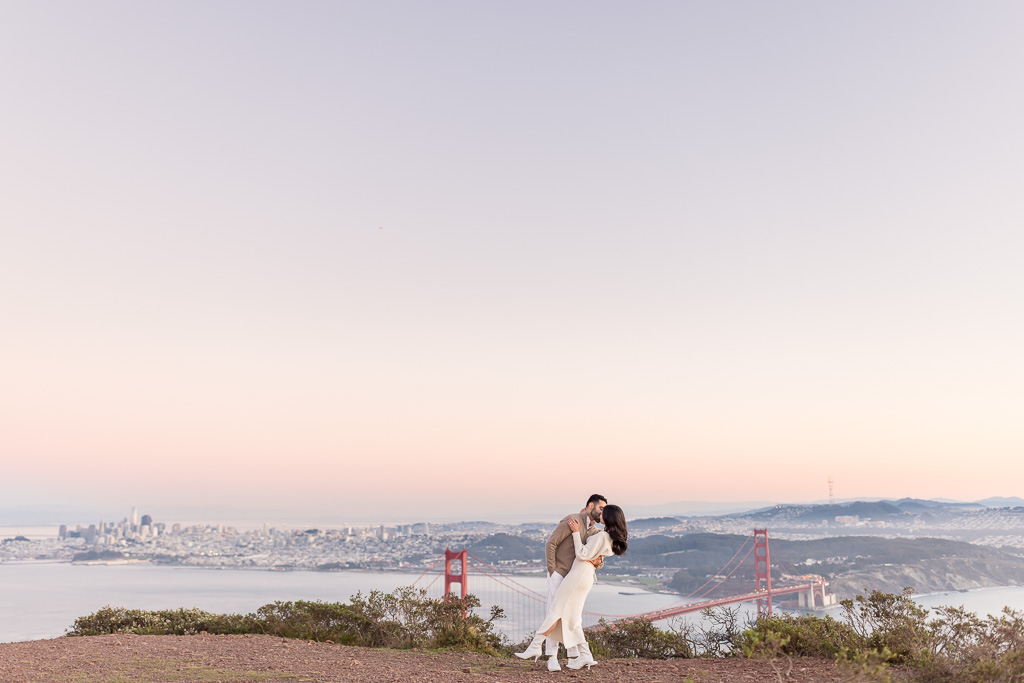 couple portrait with epic view of the Golden Gate Bridge and San Francisco
